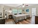 Bedroom with twin beds, wood floors, a ceiling fan, and access to an ensuite bathroom at 12020 66Th Ave, Seminole, FL 33772