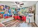 Bedroom with hardwood floors and lots of paintings at 12020 66Th Ave, Seminole, FL 33772