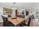 Open dining area with hardwood floors flows into the spacious living room area at 12020 66Th Ave, Seminole, FL 33772