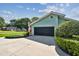 Exterior view featuring the garage, driveway, and well-maintained landscaping at 12020 66Th Ave, Seminole, FL 33772