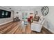 Spacious living room features beautiful hardwood floors and access to the outdoor area at 12020 66Th Ave, Seminole, FL 33772