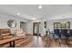 Living room and dining area boasts hardwood flooring and lots of natural light at 12020 66Th Ave, Seminole, FL 33772