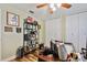 This home office features hardwood floors, a ceiling fan, built-in shelves, and closet space at 12020 66Th Ave, Seminole, FL 33772