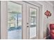A close-up view from the inside looking out onto the patio at 12020 66Th Ave, Seminole, FL 33772