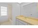 Bathroom with a big mirror over vanity sink and tiled floors and a tub at 1247 Venetia Dr, Spring Hill, FL 34608