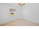 Neutral bedroom featuring carpet, a window, and bright lighting at 1247 Venetia Dr, Spring Hill, FL 34608