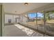 Large screened patio offering a covered outdoor space with views of the backyard and adjacent properties at 1247 Venetia Dr, Spring Hill, FL 34608