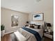 Bright bedroom featuring an accent wall, natural light, and a comfortable bed at 12620 Flatwood Creek Dr, Gibsonton, FL 33534