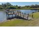 Picturesque lake with fishing dock at 12620 Flatwood Creek Dr, Gibsonton, FL 33534