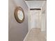 Hallway featuring modern decorative walls, recessed lighting, and light ceramic tile flooring at 12620 Flatwood Creek Dr, Gibsonton, FL 33534