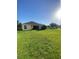 Expansive backyard featuring a well-maintained lawn, ideal for recreation and relaxation near the home at 13181 Royal Pines Ave, Riverview, FL 33579