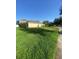 Large backyard featuring a well-maintained lawn, perfect for outdoor enjoyment at 13181 Royal Pines Ave, Riverview, FL 33579