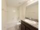 Well-lit bathroom featuring a tub and shower combo, and a vanity sink at 13181 Royal Pines Ave, Riverview, FL 33579