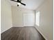 Bedroom featuring high ceilings, modern flooring, a window, and a double closet at 13181 Royal Pines Ave, Riverview, FL 33579