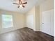 Bright bedroom featuring modern flooring, a window and a spacious closet at 13181 Royal Pines Ave, Riverview, FL 33579