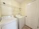 The laundry room has tile floors, washer and dryer at 13181 Royal Pines Ave, Riverview, FL 33579