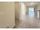 Bright, open-concept living room and dining area with neutral tile flooring and abundant natural light at 13181 Royal Pines Ave, Riverview, FL 33579
