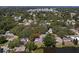 Aerial view of a lovely home and neighborhood, showcasing its peaceful surroundings at 1393 Chesterfield Dr, Dunedin, FL 34698