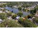 An aerial view showing the home's proximity to the beautiful lake at 1393 Chesterfield Dr, Dunedin, FL 34698