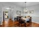 Open dining area with hardwood floors, natural light, and seating for four at 1393 Chesterfield Dr, Dunedin, FL 34698