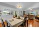 Dining area next to the kitchen and living room with views to the patio at 1393 Chesterfield Dr, Dunedin, FL 34698