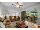 Large living room featuring sliding glass doors to the screened-in patio at 1393 Chesterfield Dr, Dunedin, FL 34698