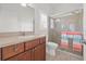 Bathroom with updated vanity, and glass-enclosed shower at 13953 Thoroughbred Dr, Dade City, FL 33525