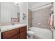 Bathroom with a vanity sink, ceramic tile, and shower over tub at 13953 Thoroughbred Dr, Dade City, FL 33525