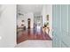 Inviting foyer with hardwood floors, elegant decor, and a glimpse into the spacious living areas at 13953 Thoroughbred Dr, Dade City, FL 33525