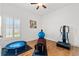 Bright exercise room featuring hardwood floors and lots of space at 13953 Thoroughbred Dr, Dade City, FL 33525