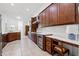 Kitchen featuring stainless steel appliances, a built-in wine cooler, and a breakfast desk at 13953 Thoroughbred Dr, Dade City, FL 33525