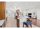 Spacious kitchen with stainless appliances, tile floor, and a breakfast bar with seating at 13953 Thoroughbred Dr, Dade City, FL 33525