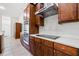 Updated kitchen with modern stainless steel appliances and dark wood cabinetry at 13953 Thoroughbred Dr, Dade City, FL 33525
