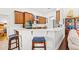 Bright kitchen with white counters, stainless steel appliances, and dark wood cabinetry at 13953 Thoroughbred Dr, Dade City, FL 33525