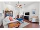 Comfortable living room featuring hardwood floors, stylish furnishings, and an inviting atmosphere at 13953 Thoroughbred Dr, Dade City, FL 33525