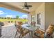 Covered patio with a dining table, comfortable seating, and backyard views at 13953 Thoroughbred Dr, Dade City, FL 33525