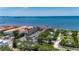 Aerial view showcases community amenities, waterfront views, and residential buildings at 1420 Bayshore Blvd # 409, Dunedin, FL 34698