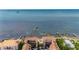 Panoramic aerial view of waterfront property with boat docks and stunning ocean views at 1420 Bayshore Blvd # 409, Dunedin, FL 34698