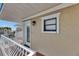 This condo features a private balcony with white railings and a view of the surrounding complex at 1420 Bayshore Blvd # 409, Dunedin, FL 34698