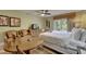 Relaxing living room boasts cozy seating, a king bed, and an adjacent dining space at 1420 Bayshore Blvd # 409, Dunedin, FL 34698