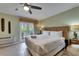 Relaxing living room boasts a king bed, and French doors leading to a terrace at 1420 Bayshore Blvd # 409, Dunedin, FL 34698