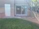 Private back yard with patio, a grassy area, and sliding glass doors to the home at 1512 Chateaux De Ville Ct, Clearwater, FL 33764