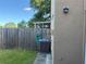 Backyard with grass and a wooden fence surrounding the property at 1512 Chateaux De Ville Ct, Clearwater, FL 33764