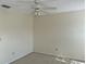 Bedroom features a ceiling fan and carpeted flooring at 1512 Chateaux De Ville Ct, Clearwater, FL 33764