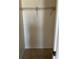 A bright, empty walk-in closet with carpet flooring and a white wire shelf at 1512 Chateaux De Ville Ct, Clearwater, FL 33764