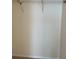 An empty closet equipped with overhead shelving and storage options at 1512 Chateaux De Ville Ct, Clearwater, FL 33764