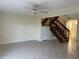 Open living area with tiled floor and staircase at 1512 Chateaux De Ville Ct, Clearwater, FL 33764