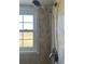 Shower with updated shower head and window at 1512 Chateaux De Ville Ct, Clearwater, FL 33764