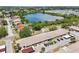Aerial view of the condo buildings featuring a lake in the background at 1515 12Th Se Ct # 55, Largo, FL 33771
