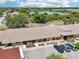 Aerial view of building with ample parking and verdant community landscaping at 1515 12Th Se Ct # 55, Largo, FL 33771